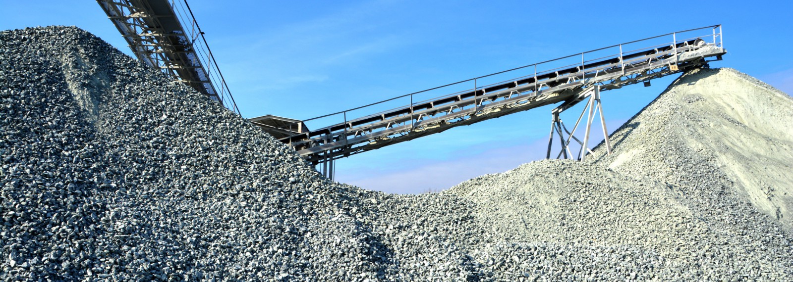 Heavy machinery of gravel production in quarry.